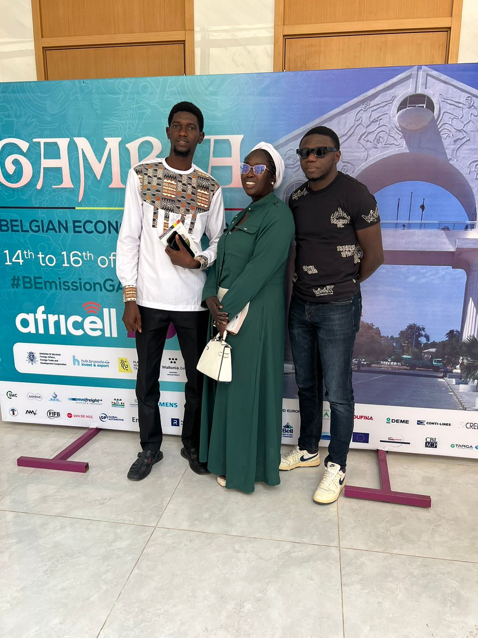 Fatou Sawo speaking with agents at the hotline desk